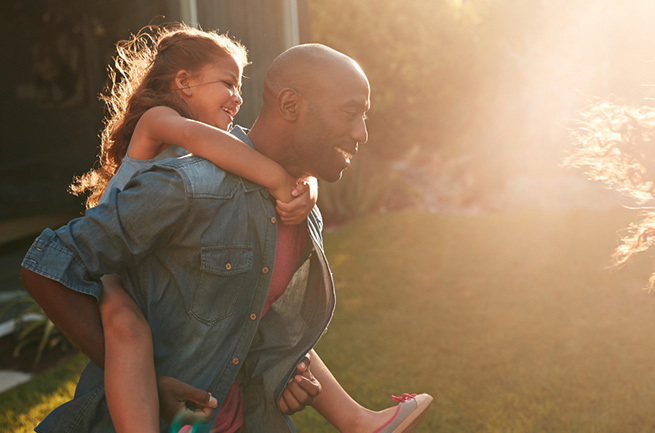 Man playing with his daughter